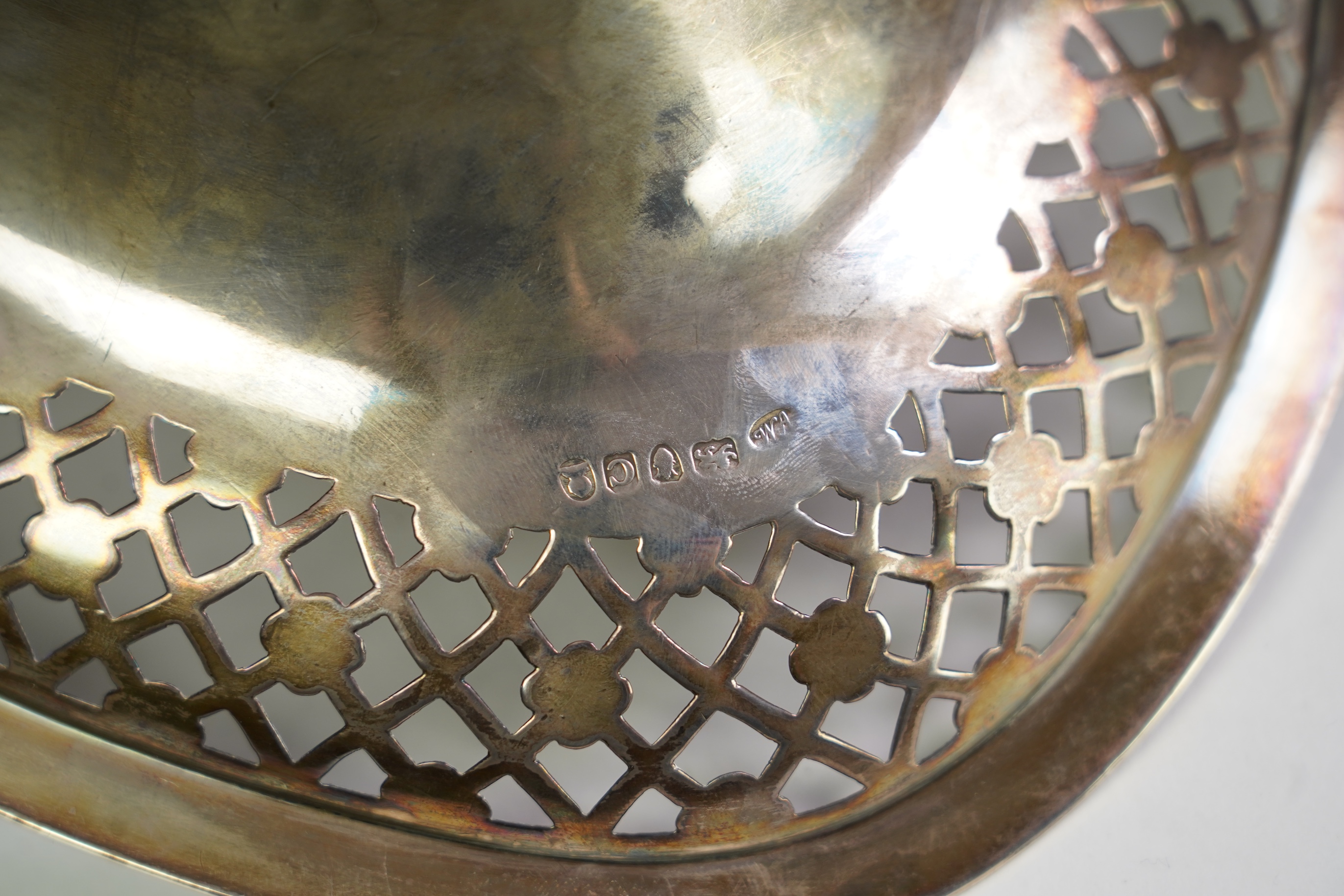 A George III silver oval cake basket, by William Allen III